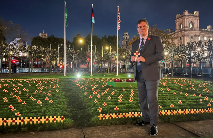 Jonathan Lord MP places a tribute on behalf of Woking in Westminster's Garden of Remembrance