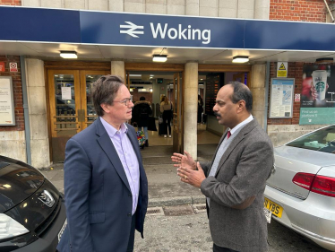 Jonathan Lord MP at Woking Railway Station with a Constituent 